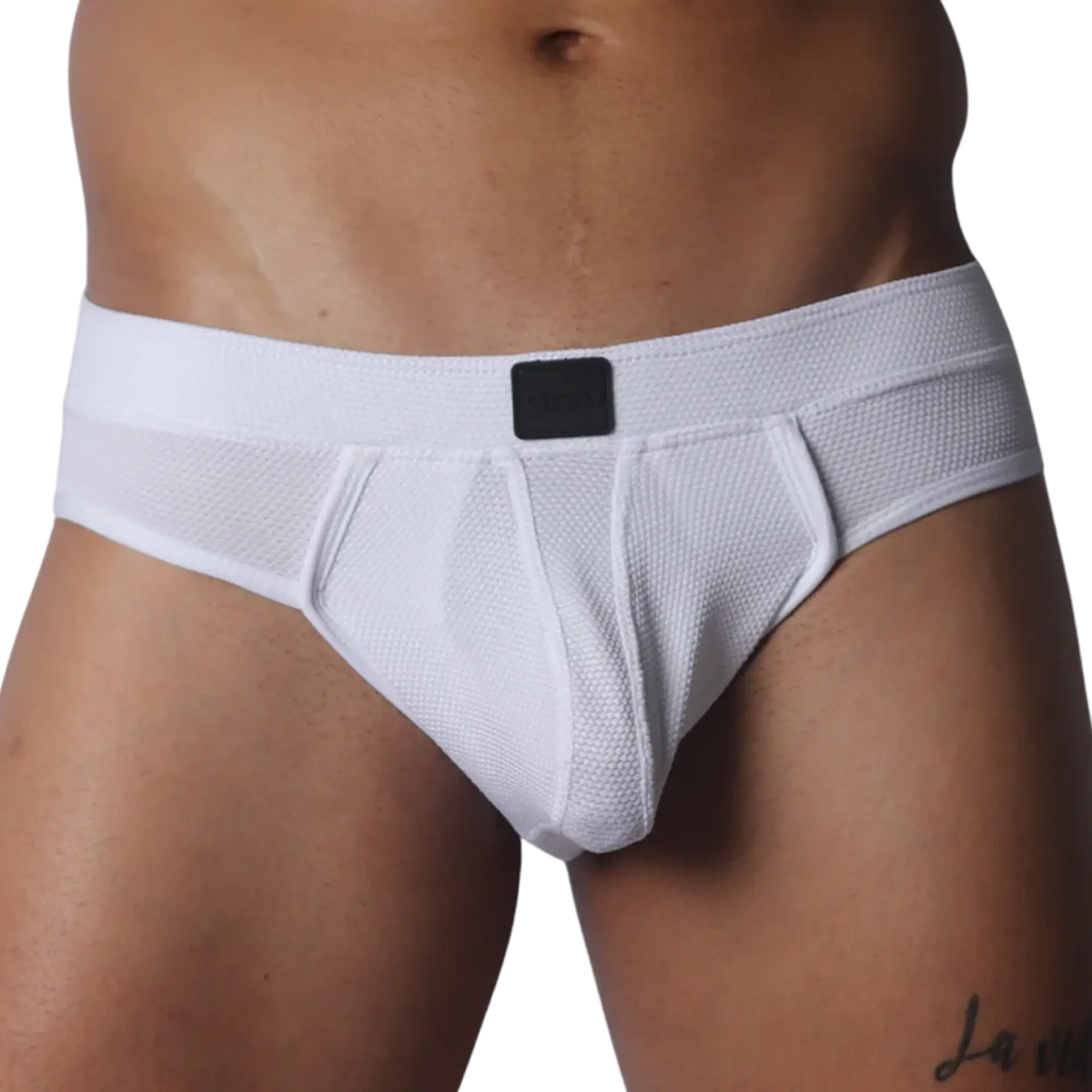 White mesh jockstrap with a textured finish, thick waistband, and a centered black Gigo logo patch.