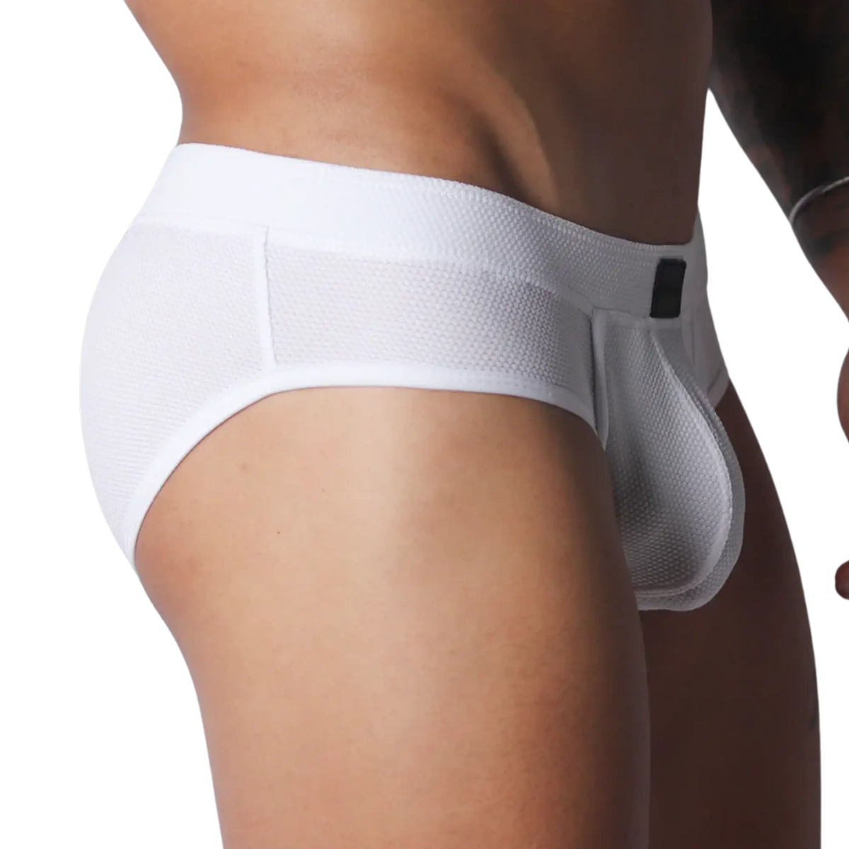 White athletic-style briefs made from textured, breathable mesh fabric with a thick waistband and contoured pouch.