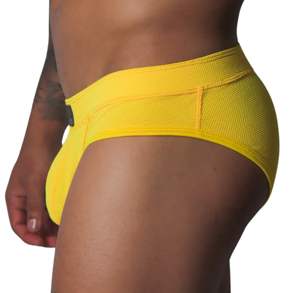 Bright yellow low-rise brief in textured, breathable honeycomb mesh fabric with a wide supportive waistband.