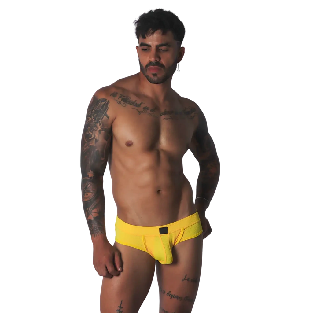 Bright yellow mesh low-rise brief with a centered rectangular black logo patch.