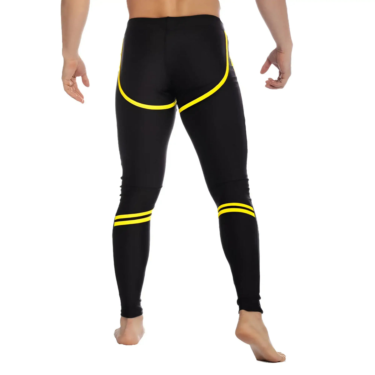 Black gigo core leggings with bold yellow accent stripes along sides and ankles for athletic wear