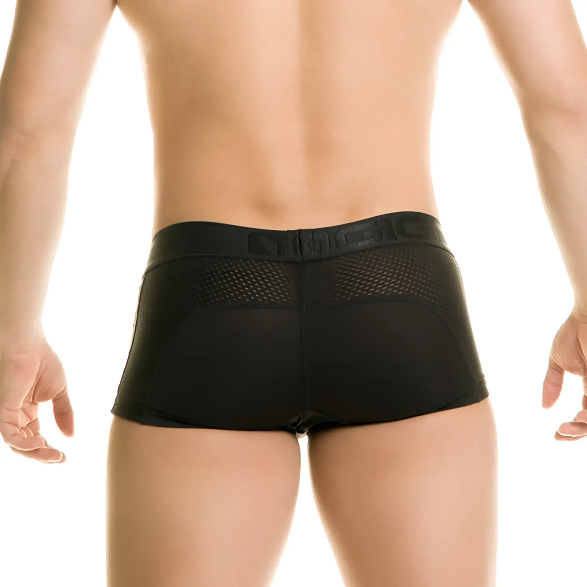 Black mesh briefs with a solid black waistband featuring the magic logo in the gigo diversity black trunk design