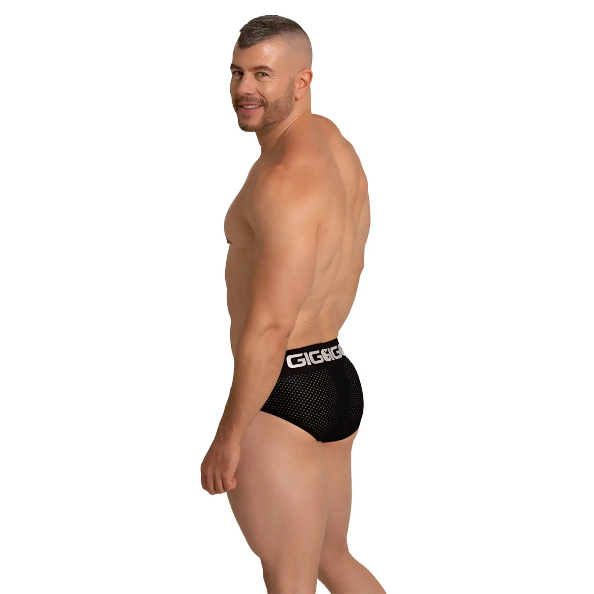 Black mesh briefs with a white giggi logo on the waistband from the gigo energetic black brief collection