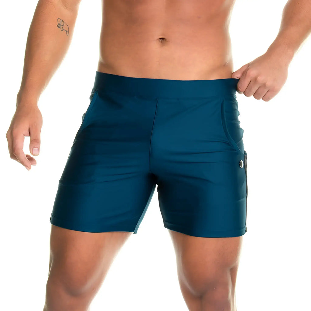 Teal gigo energetic green high-waisted athletic shorts with side pockets and subtle thigh logo for active wear