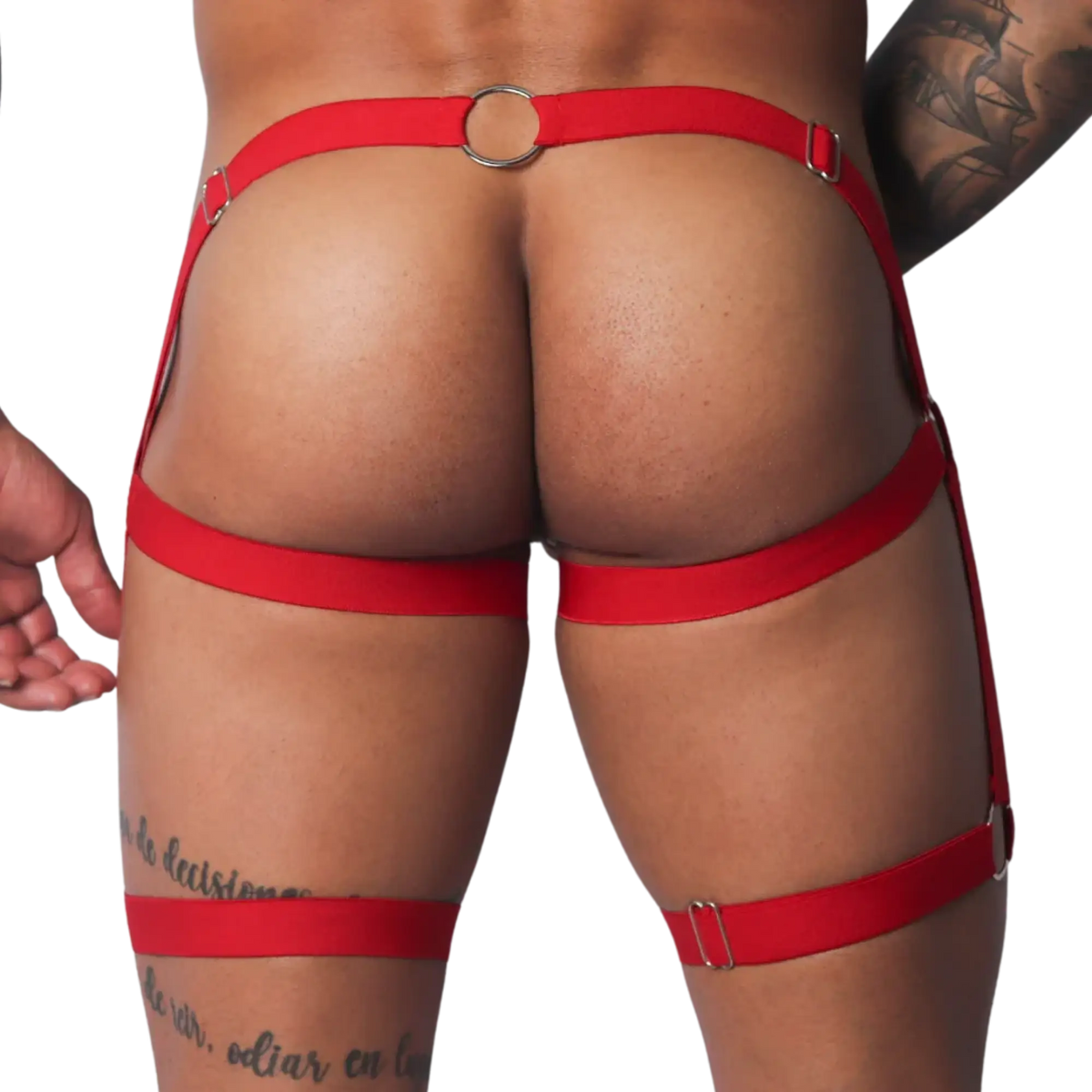 Bright red elastic harness belt with metallic silver rings and sliders, designed to wrap around the waist and thighs.