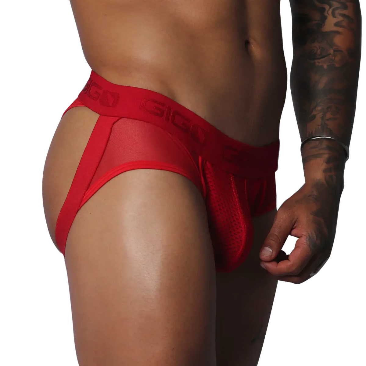 Red jockstrap thong featuring sheer mesh fabric, a pouch, and a branded elastic waistband on a muscular torso.