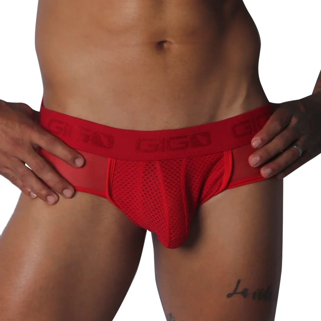 Red mesh jockstrap with a branded elastic waistband, featuring sheer side panels and a supportive contour pouch.