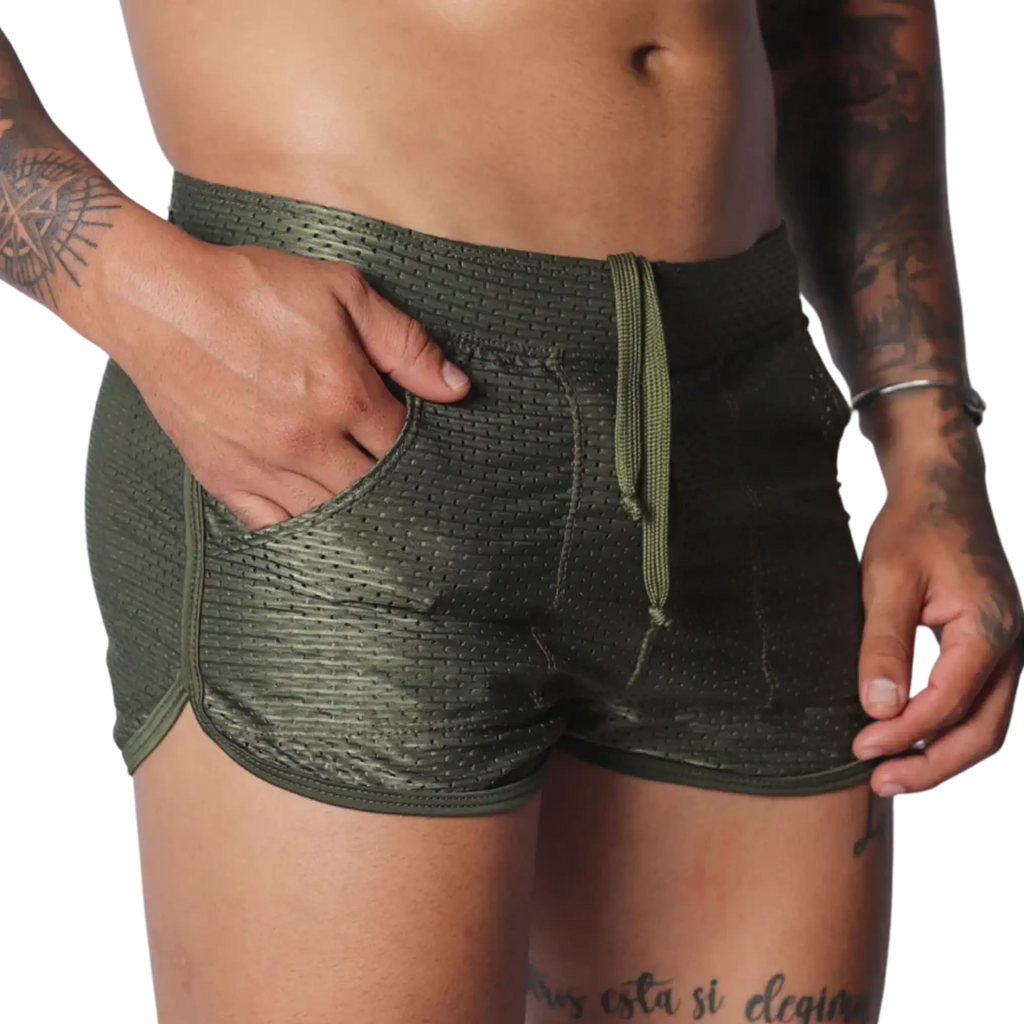 Olive green mesh athletic shorts with a drawstring waist, side pockets, and a short-cut curved hem.