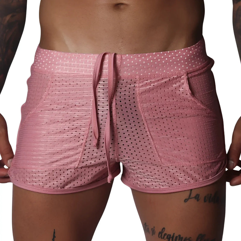 Pink mesh athletic shorts with a drawstring waistband, two side pockets, and a shorter, fitted cut.