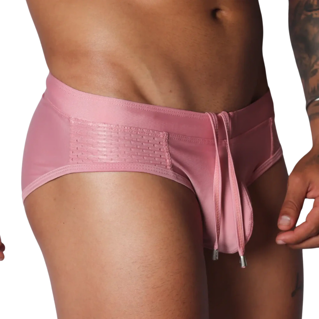 Gigo pink swim brief with mesh side panels and a drawstring waist featuring metal-tipped ties.