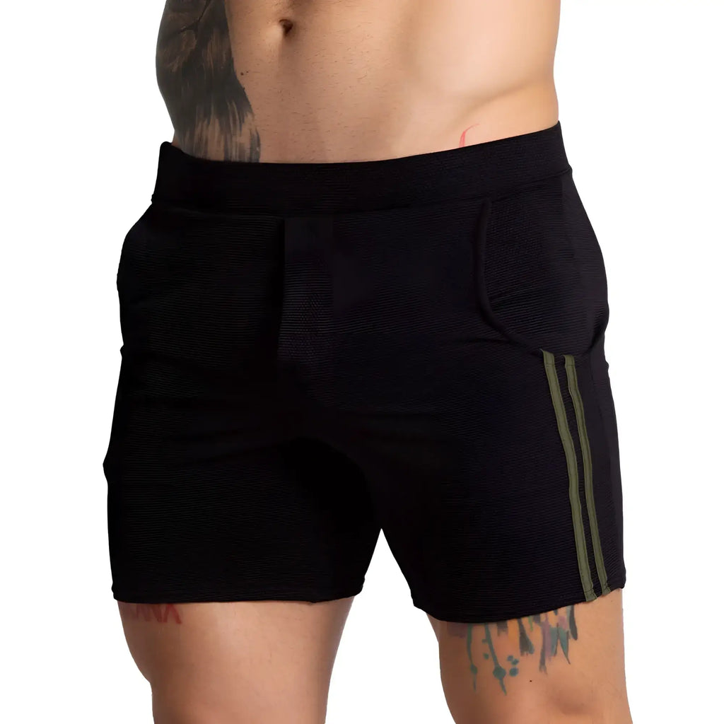 Black textured athletic shorts with olive green side stripes from Gigo F Fetish Green Short collection