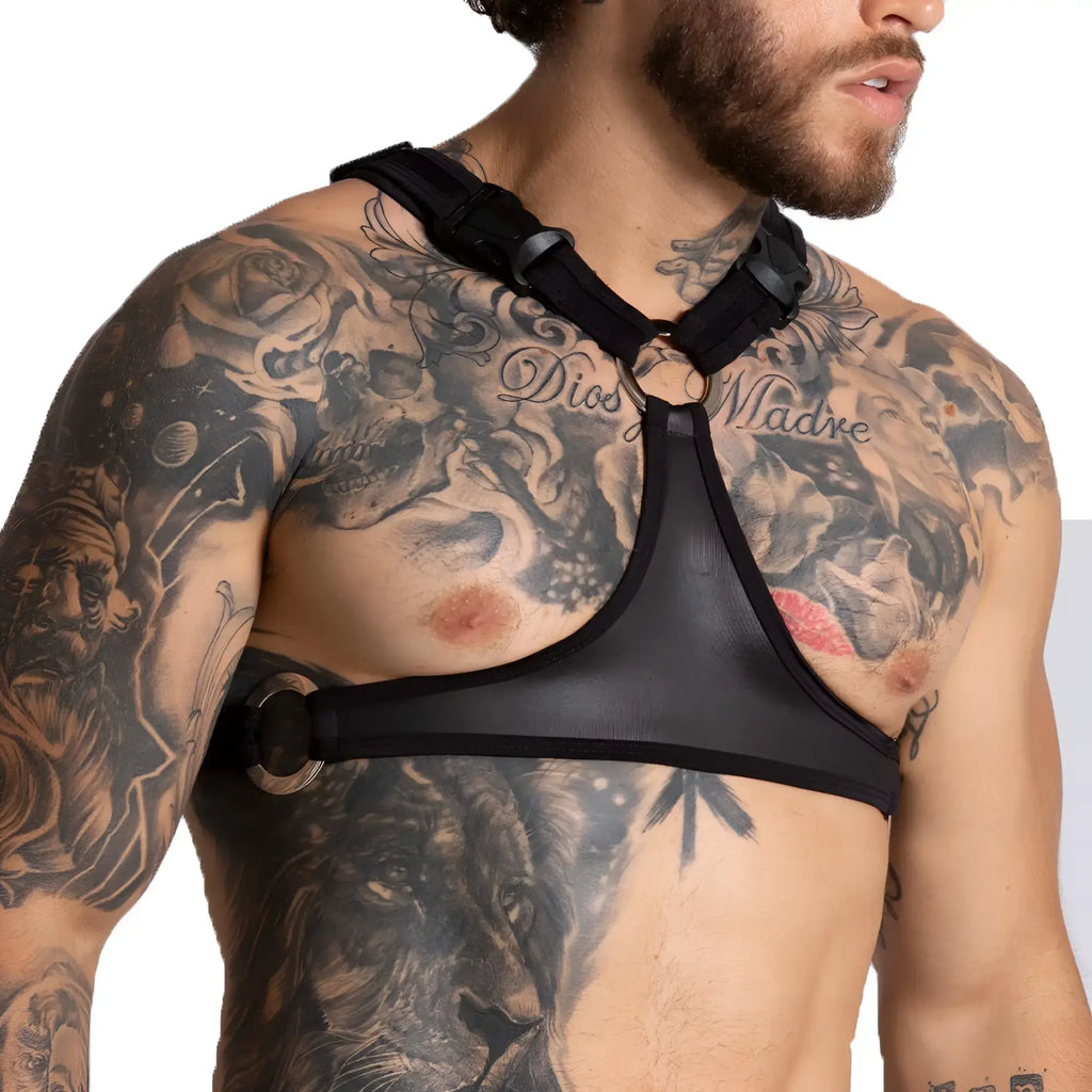 Black mesh gigo f fetish harness with adjustable straps and metallic circular buckles shown from the back side