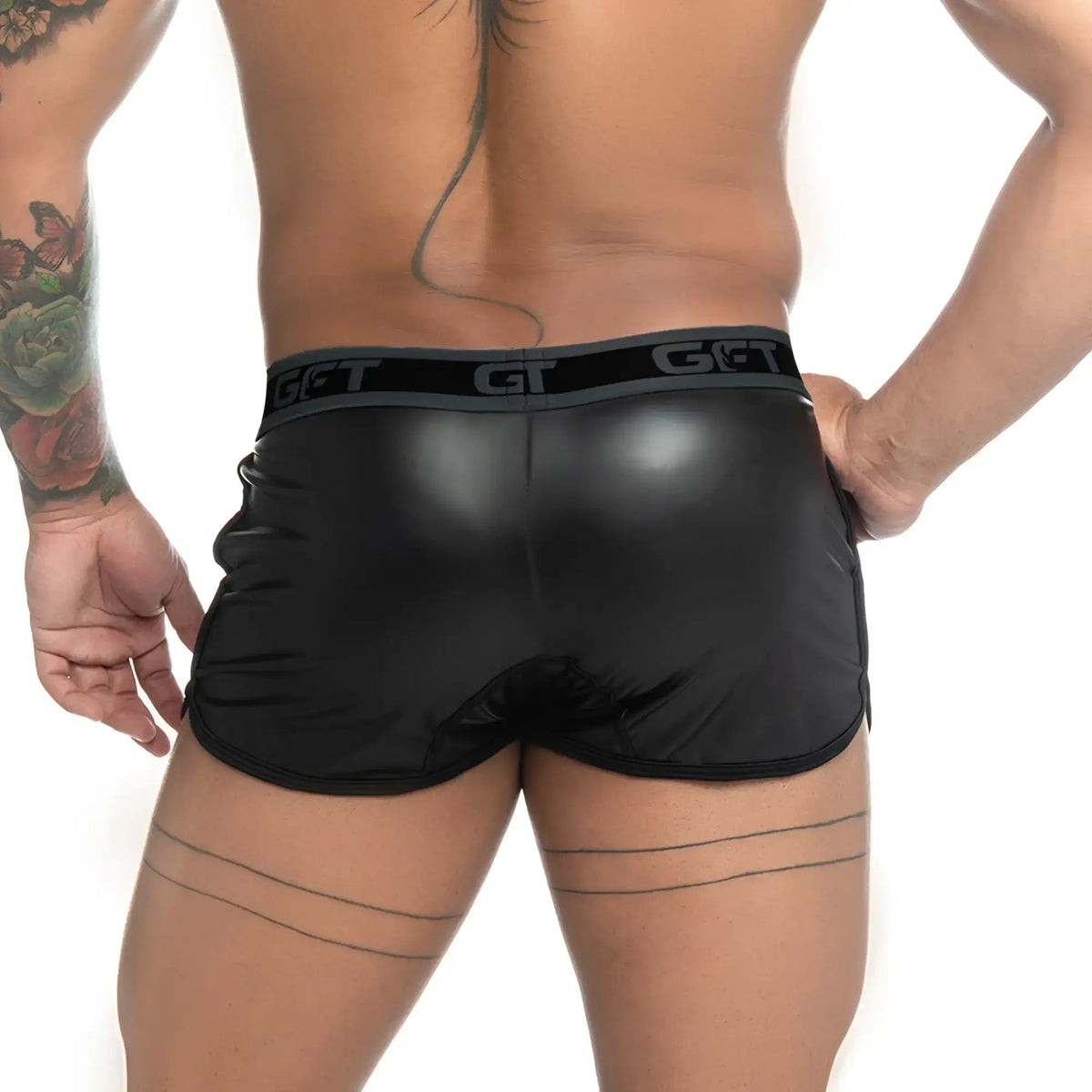 Black glossy faux leather shorts with gray elastic waistband featuring get logo gigo fetiche black short