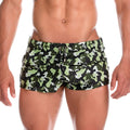 Green and black camouflage swim trunks with zipper details from gigo fighter beachwear for outdoor water activities