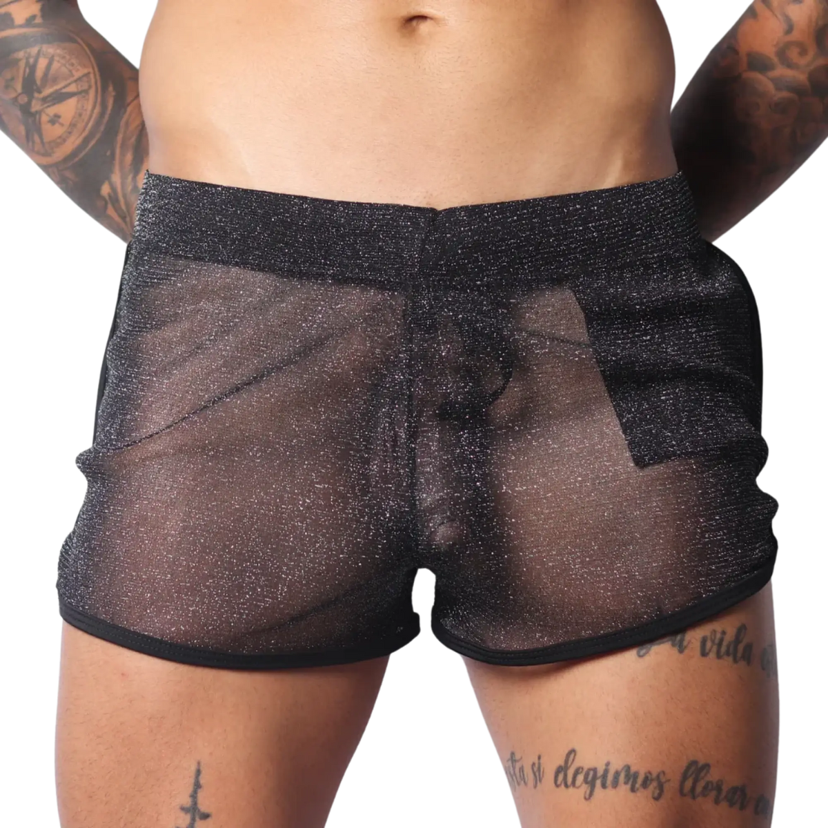 Sheer black metallic glitter shorts with a comfortable elastic waistband and black hem trim.