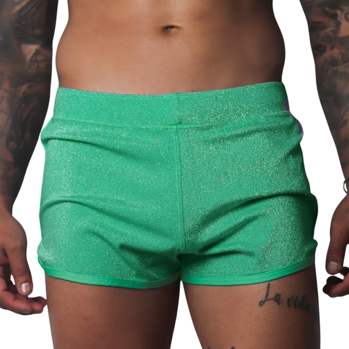 Flash green, form-fitting glittery athletic shorts with a clean hem and elastic waistband.