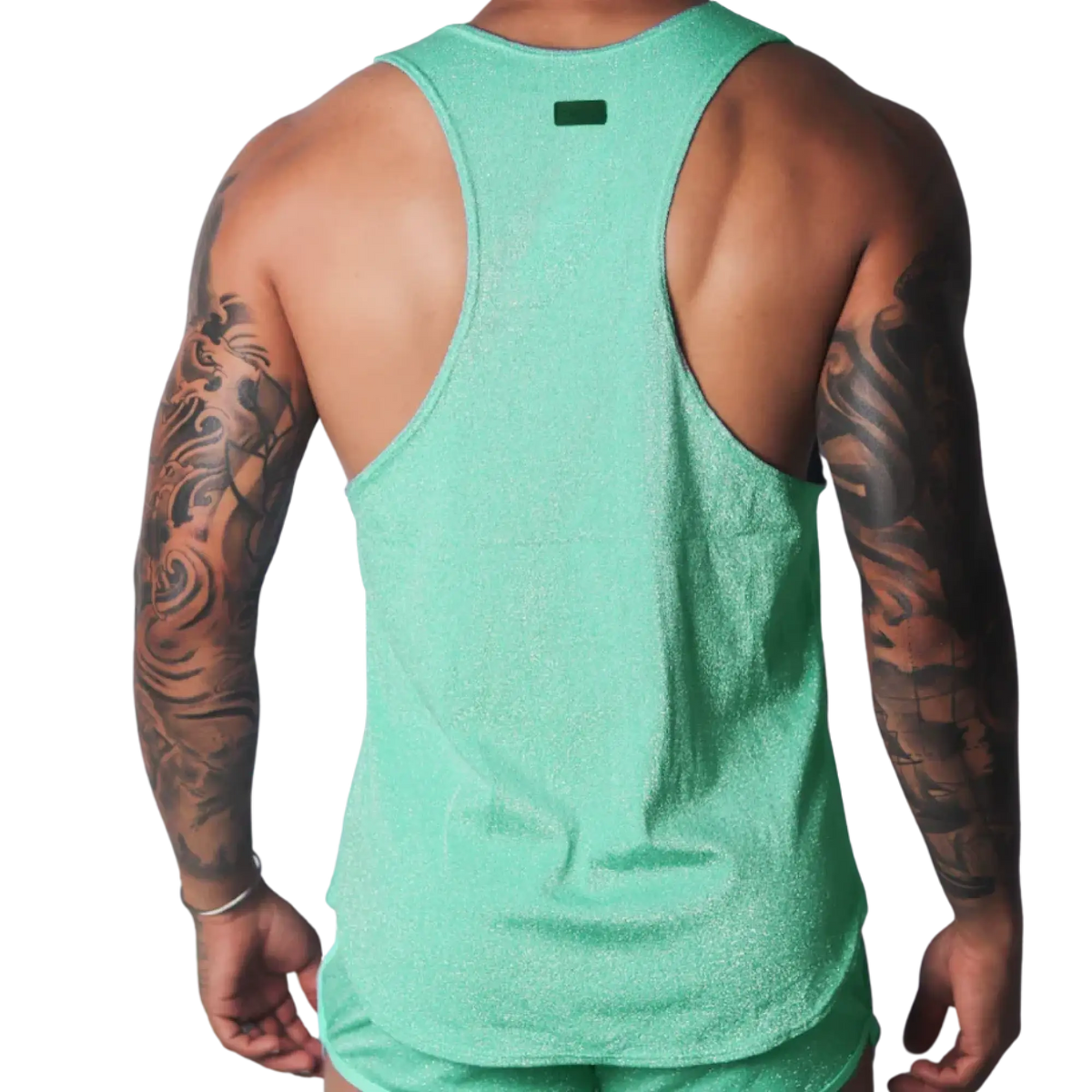 Shimmering mint green racerback tank top with a small rectangular logo patch on the upper back.