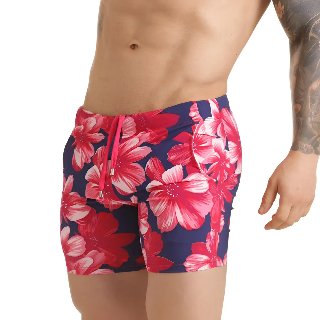Navy blue gigo flowers fucshia swim trunks with vibrant pink and white floral pattern and matching drawstring