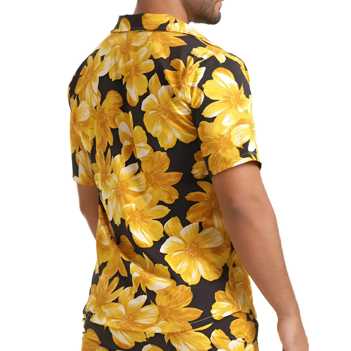Gigo Flowers yellow shirt with vibrant yellow floral print short sleeves on black background with bold gold and white