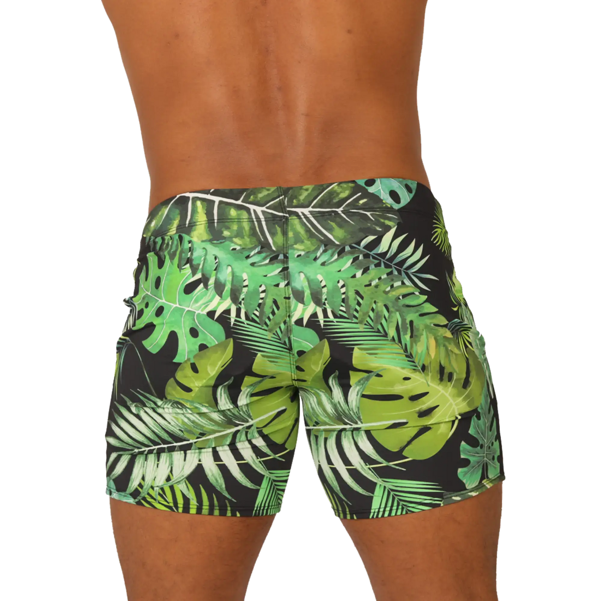 Black swim trunks from gigo forest beachwear with vibrant green and white tropical leaf pattern for beach use