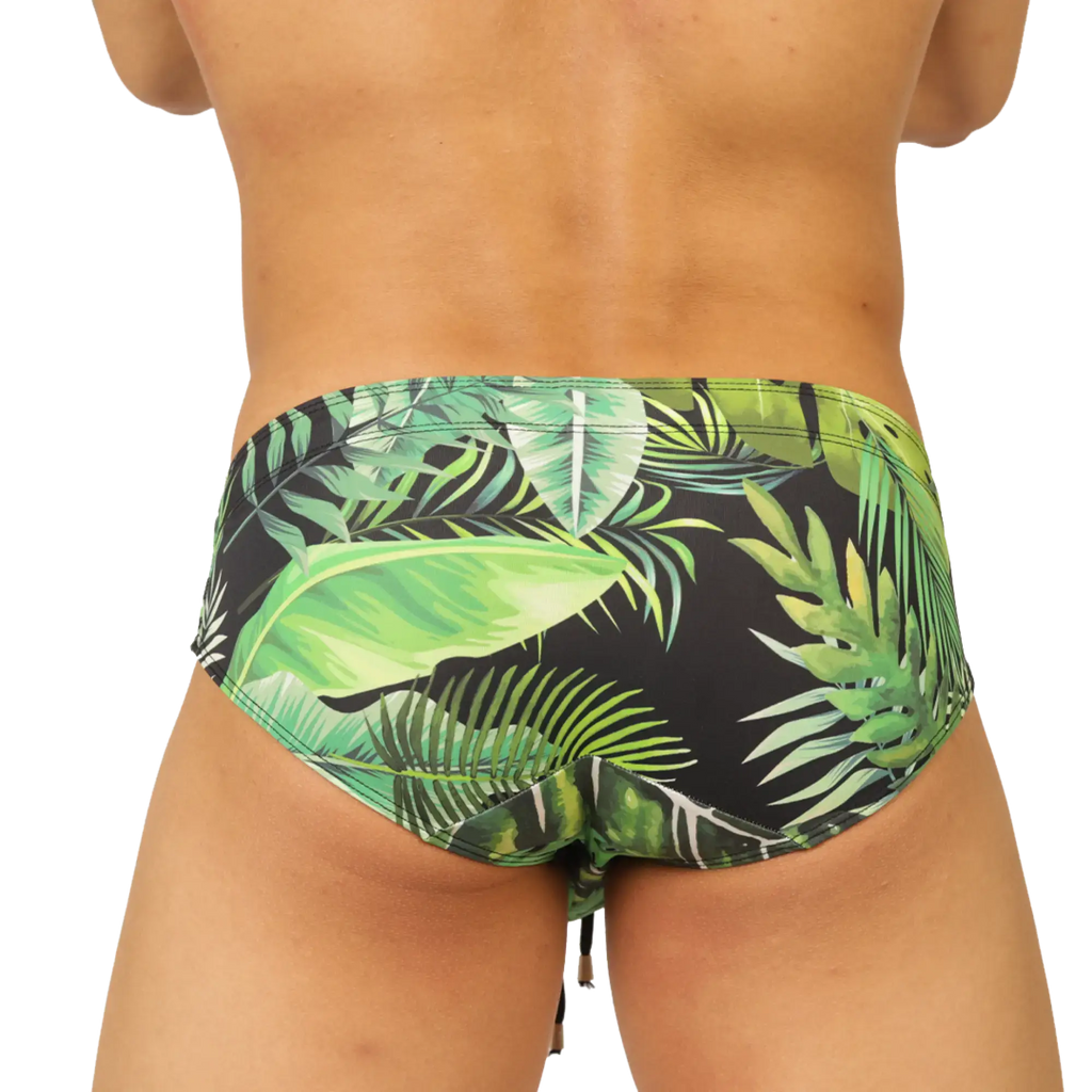 Black gigo forest swimbrief with vibrant green tropical leaf pattern made for swimming and beachwear