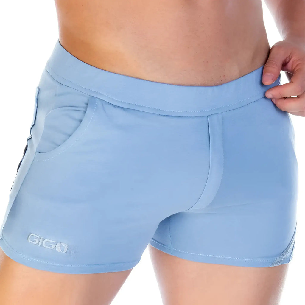 Light blue gigo forever blue gray athletic shorts with sleek form fitting design and subtle side pocket detailing