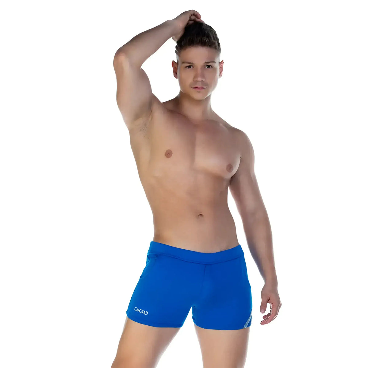 Bright blue gigi swim trunks with a sleek form fitting design and subtle white branding on the left leg