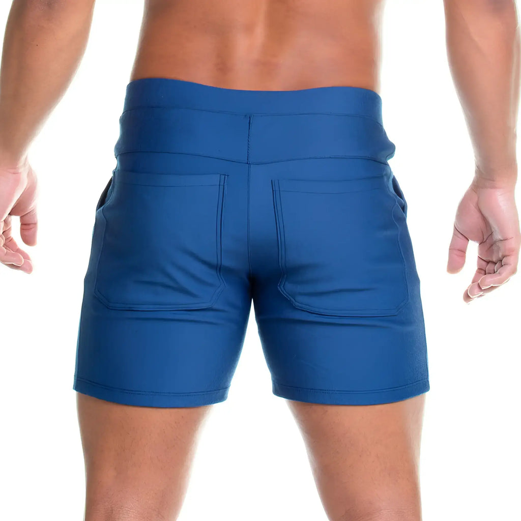 Image of the back side of blue gigo formal jean shorts with high-waisted design and two back pockets