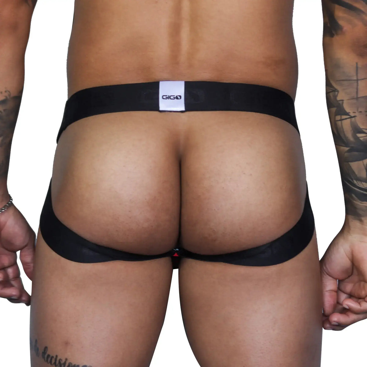 Black giga brand thong with white label and red accent detail shown from the back in gigo fresh red jockstrap product
