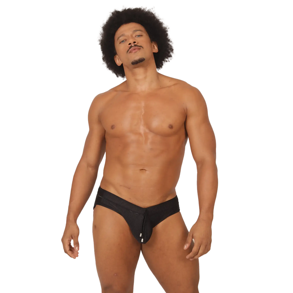Black athletic swimbrief with central zipper closure designed for active wear in gigo glow style