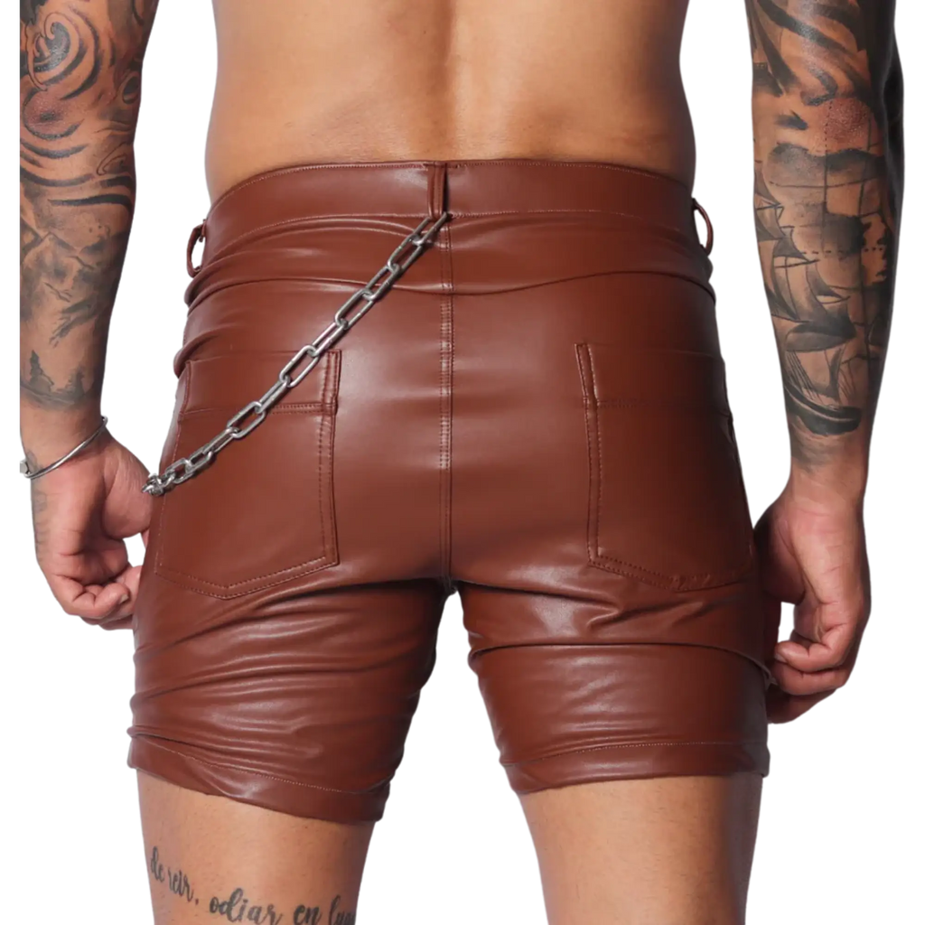 Brown faux leather fitted shorts featuring a back silver chain accent, dual pockets, and a classic five-pocket design.