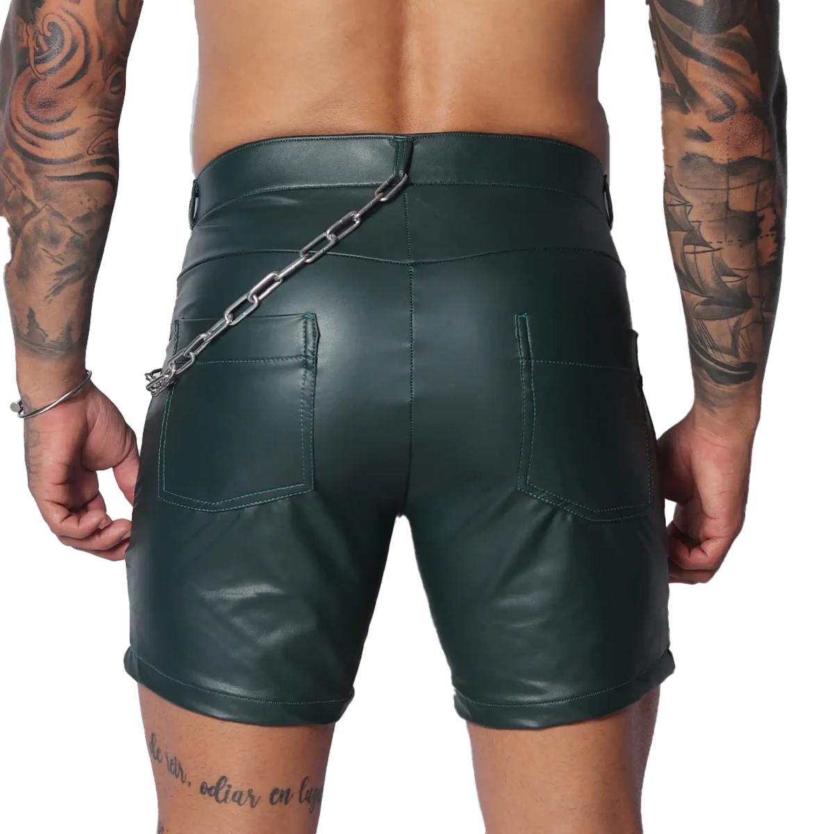 Dark green faux leather shorts with back pockets and a silver chain accessory attached to the waistband.