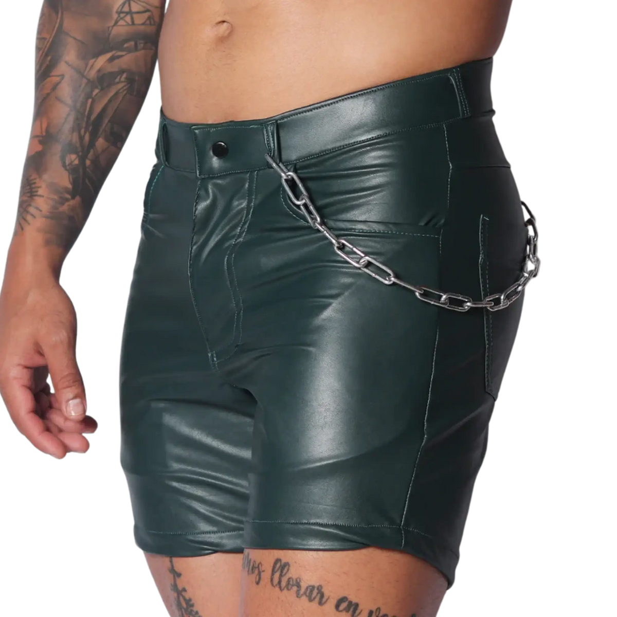 Dark green faux leather fitted shorts with a silver chain accessory attached to the waistband.