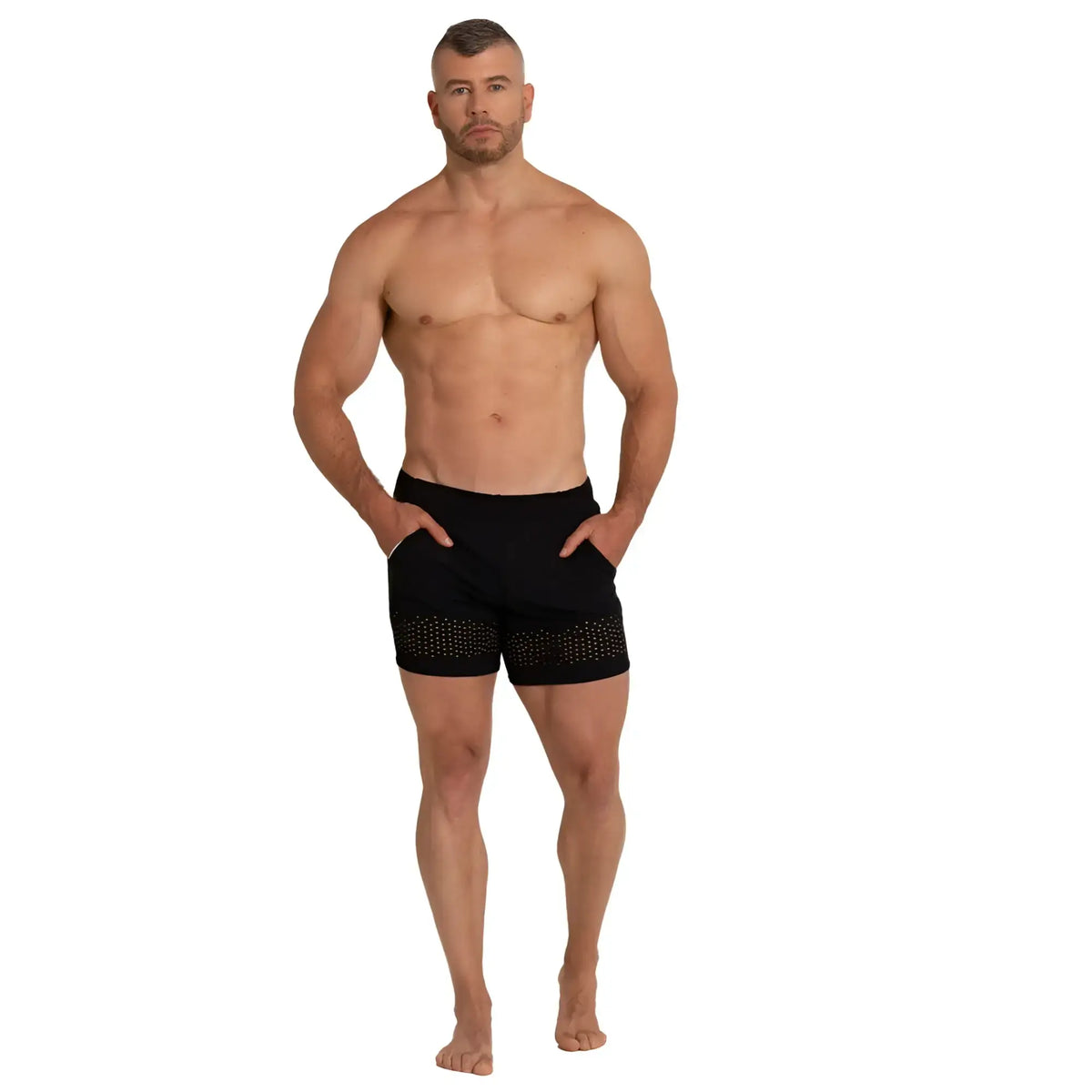 Black athletic shorts with dotted pattern along the lower hem from gigo hole black beachwear collection