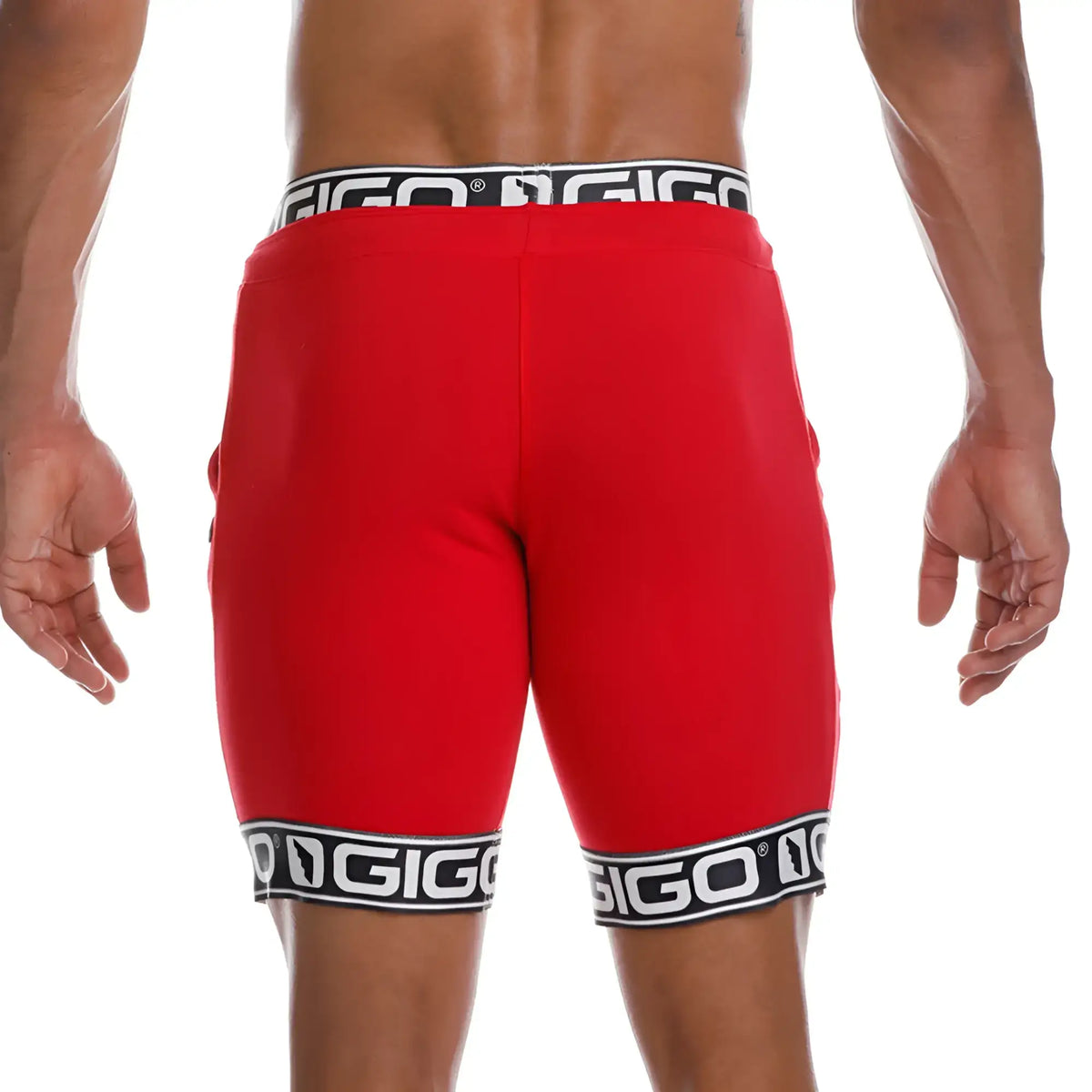 Red gigo brand athletic shorts featuring black and white logo trim at waistband and hem for active wear
