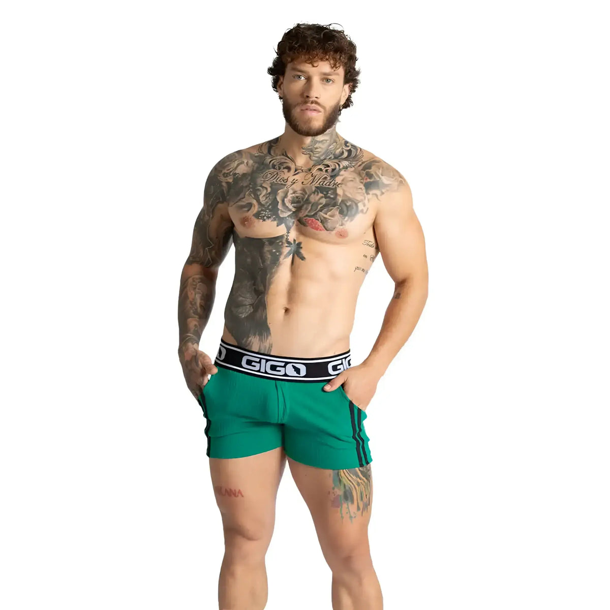 Green athletic shorts with black waistband featuring gigo logo in white lettering from gigo khanal green short collection