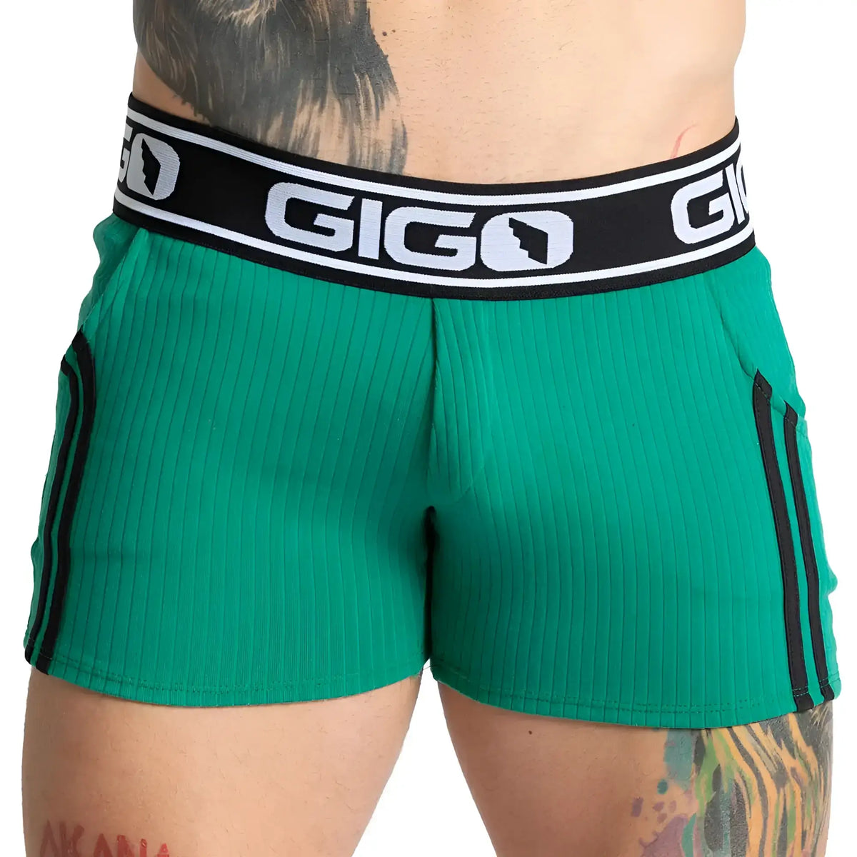 Gigo Khanal green ribbed athletic shorts with black side stripes and branded waistband for active wear