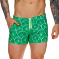 Bright green Gigo lemons swim trunks with sliced lime pattern and lime green drawstrings for beachwear use