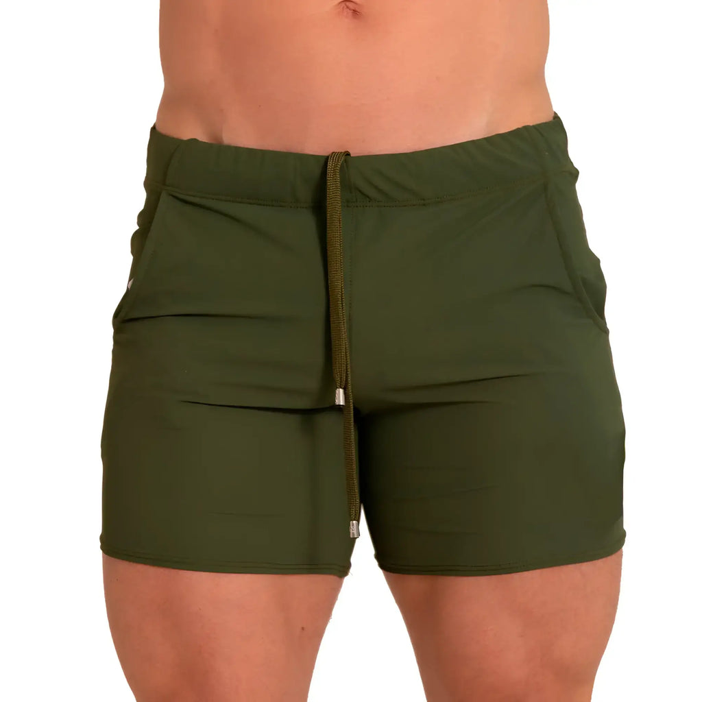 Olive green athletic shorts with drawstring waistband and side pockets from gigo letters green beachwear collection
