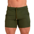 Olive green athletic shorts with drawstring waistband and side pockets from gigo letters green beachwear collection