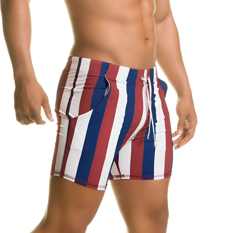 Gigo Line beachwear swim trunks with vertical red white and blue stripes and a drawstring waistband