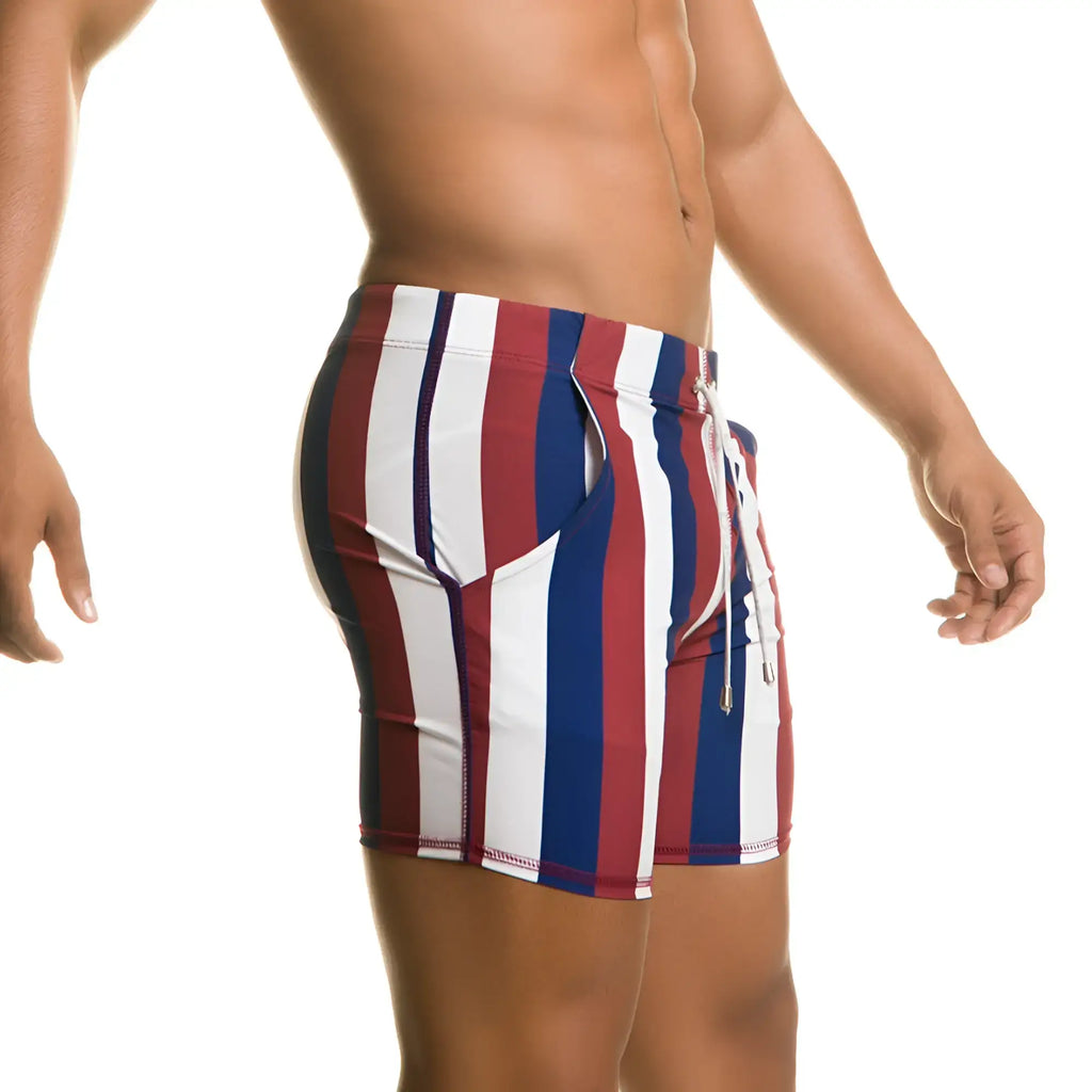 MenÃ¢â‚¬â„¢s gigo line beachwear swim trunks with red white and blue vertical stripes and a drawstring waistband