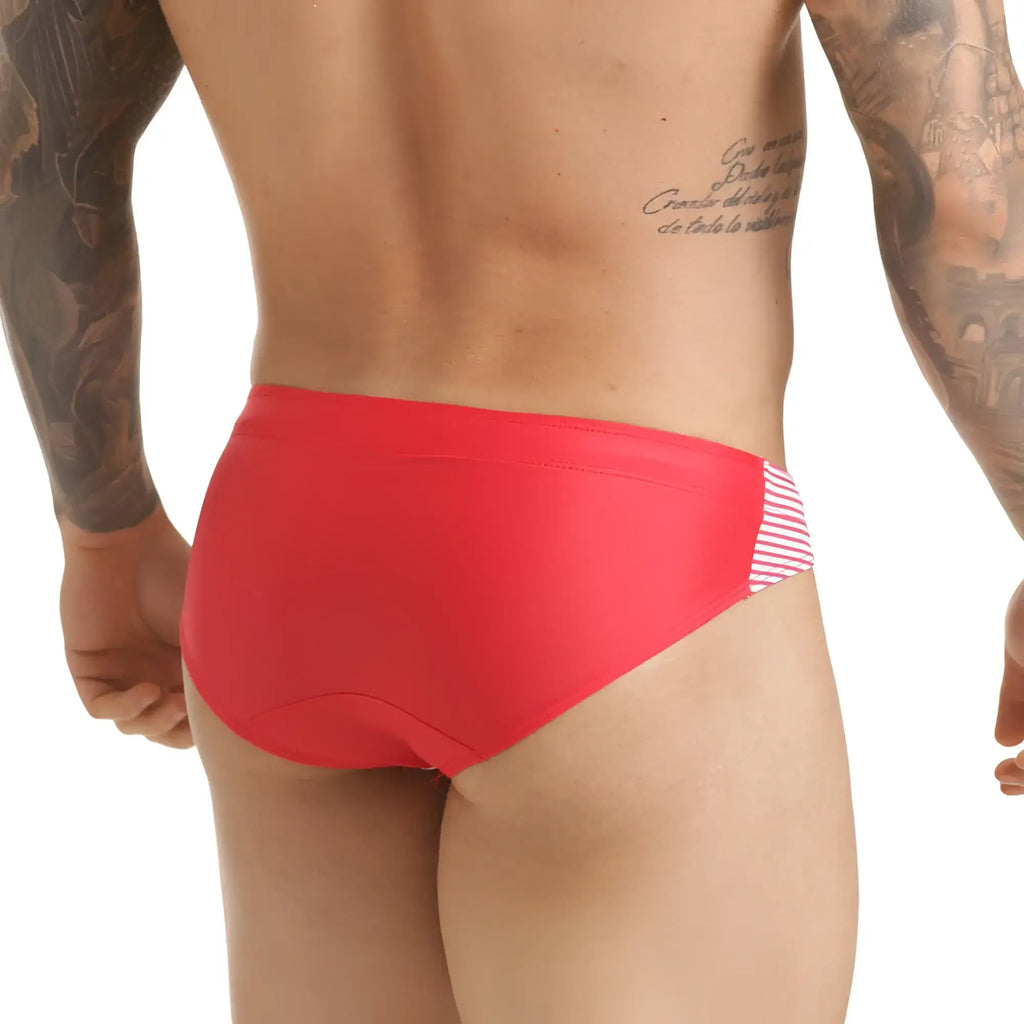Bright red gigo marine swim brief with white and pink striped side panel designed for swimming use