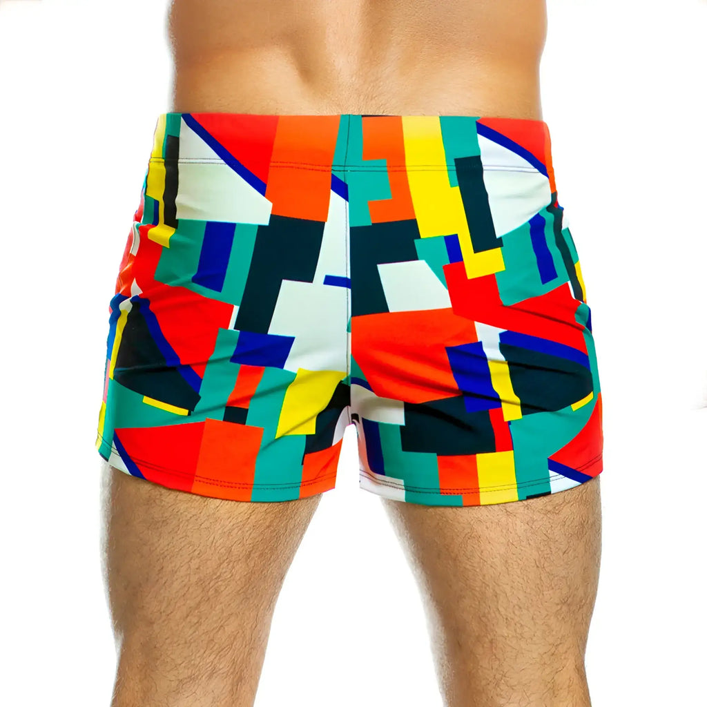 Vibrant gigo multicolour beachwear swim trunks with bold geometric patterns in red yellow green blue and black hues