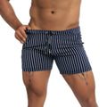 Navy blue and white vertically striped swim trunks with a drawstring waistband from Gigo Naval Blue Beachwear