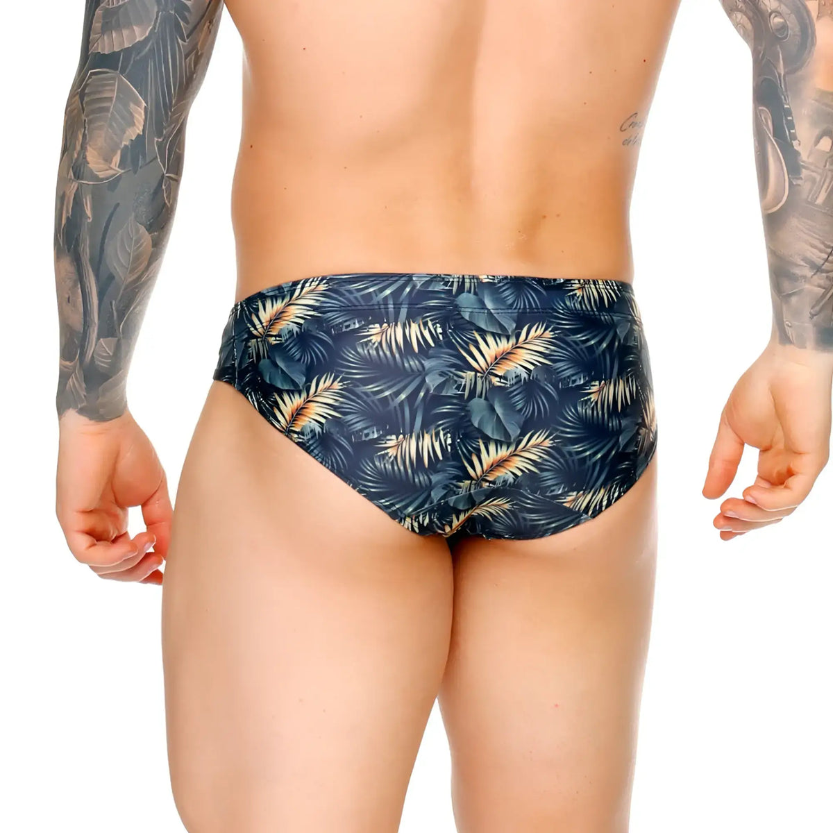 Dark blue gigo palms swim brief with vibrant gold and green tropical leaf pattern for stylish swimwear looks