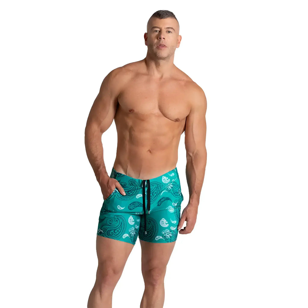 Teal and white paisley pattern swim trunks with black drawstring from gigo paradise beachwear for beach use