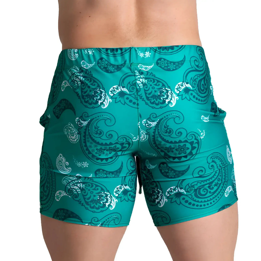 Teal and white paisley patterned swim trunks from gigo paradise beachwear ideal for beach and pool use