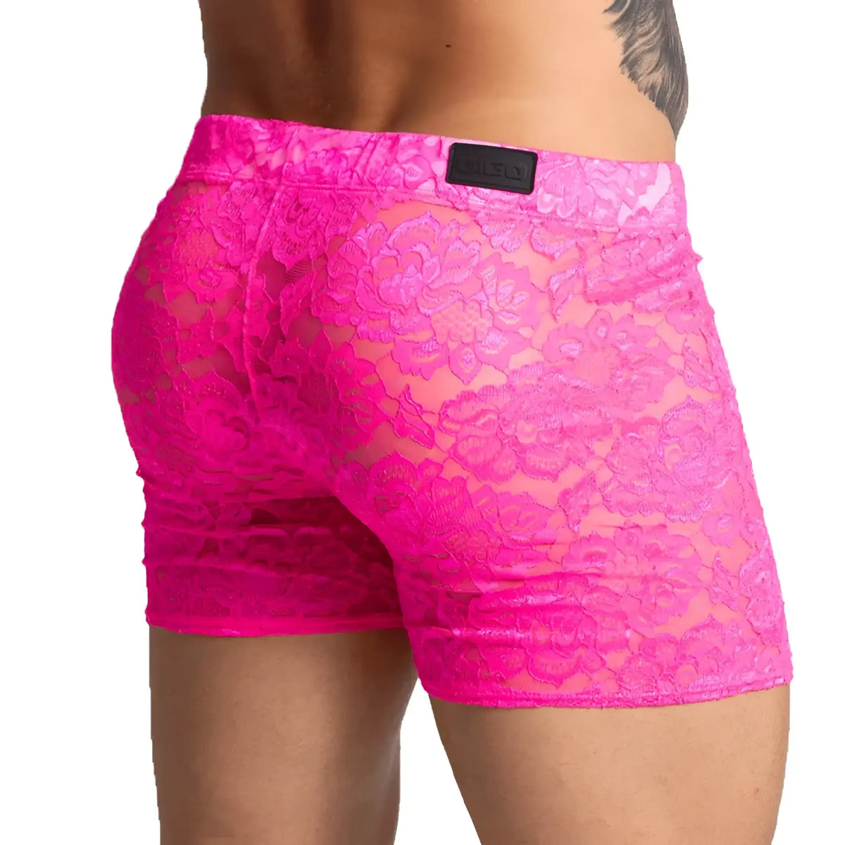 Bright pink lace menÃ¢â‚¬â„¢s shorts with a floral pattern and black brand patch on the waistband from Gigo Paradise
