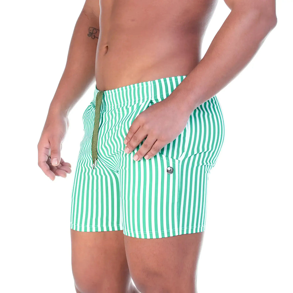 Green and white vertically striped swim trunks with drawstring waistband from gigo polo green beachwear collection